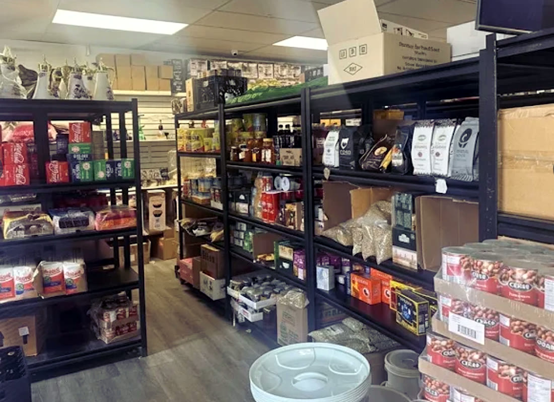 Store shelves stocked with teff, grains and packaged staples